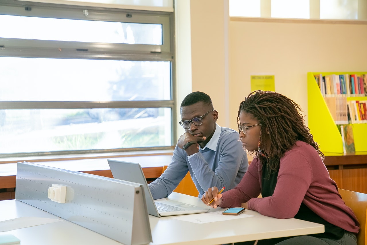 two youths on a computer